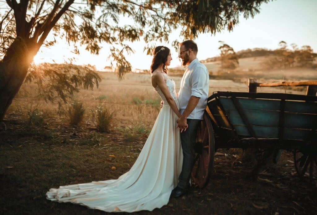 man and woman standing beside carriage